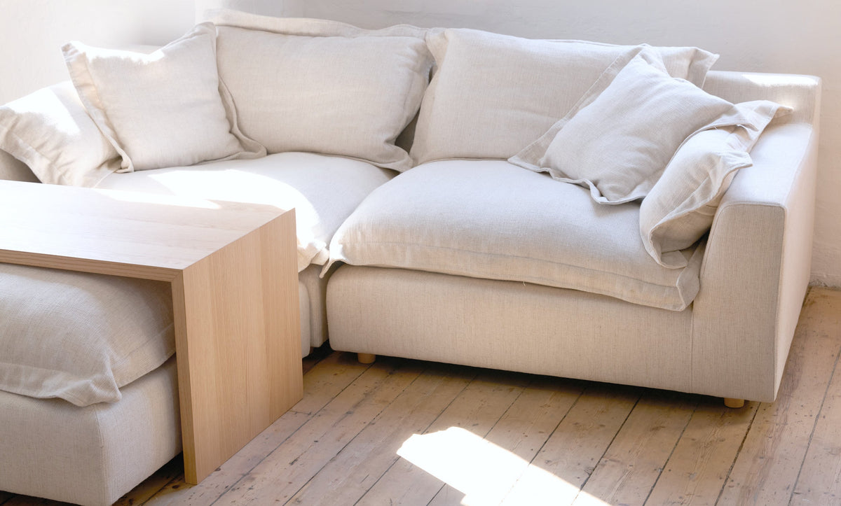 Cloud Range ottoman table top in American oak in a sunlit living room