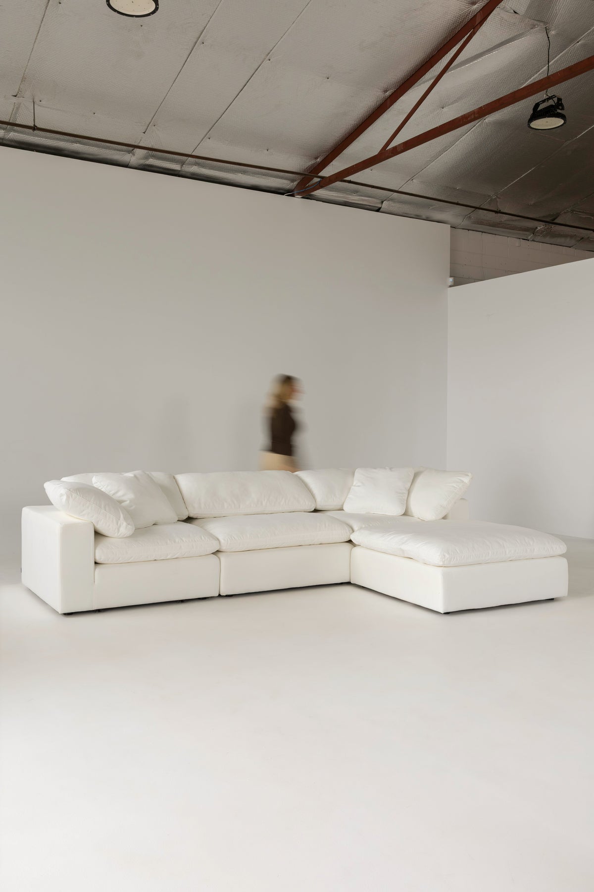 Cloud Classic sofa with chaise in a studio space